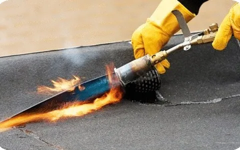GRP fibreglass flat roofing being torch-applied